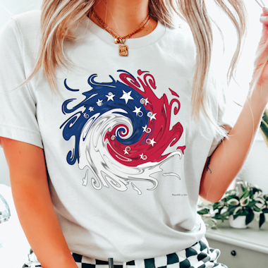 Woman wearing a t-shirt with a swirl of patriotic colors. Tap to go to Republic on Etsy.